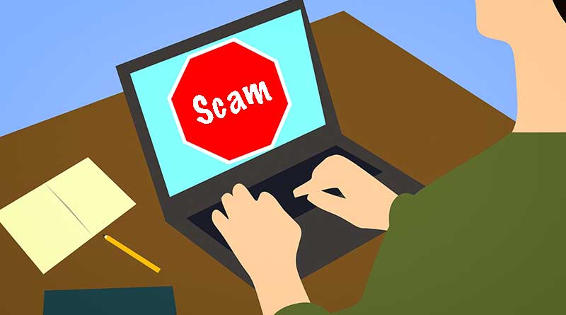 A magnifying glass over the word scam