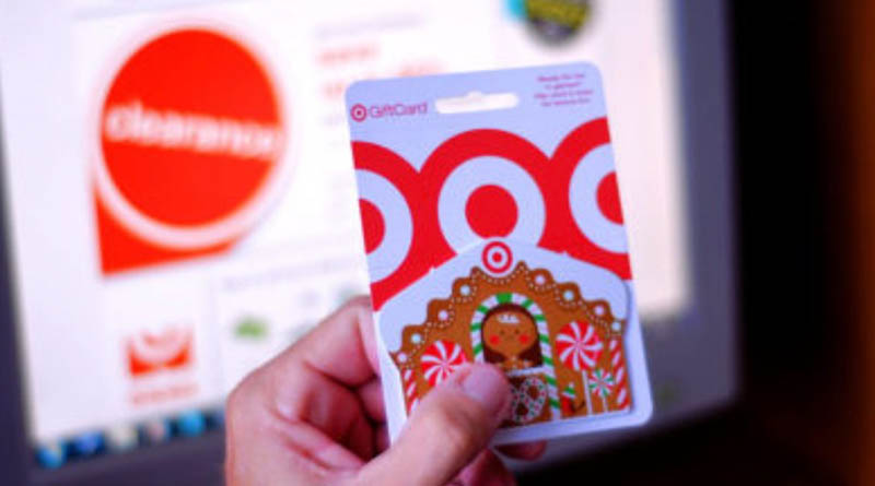 A Target gift card held in a person's hand